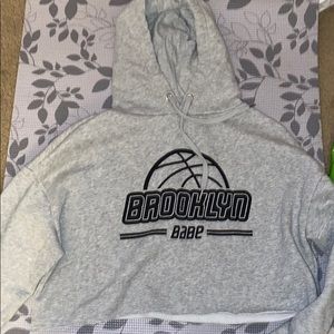 Grey Brooklyn Babe cropped sweatshirt.